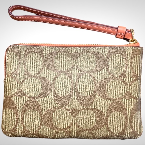 Coach Corner Zip Wristlet in Signature
Canvas Tan with Coral Stripe - Picture 2 of 5